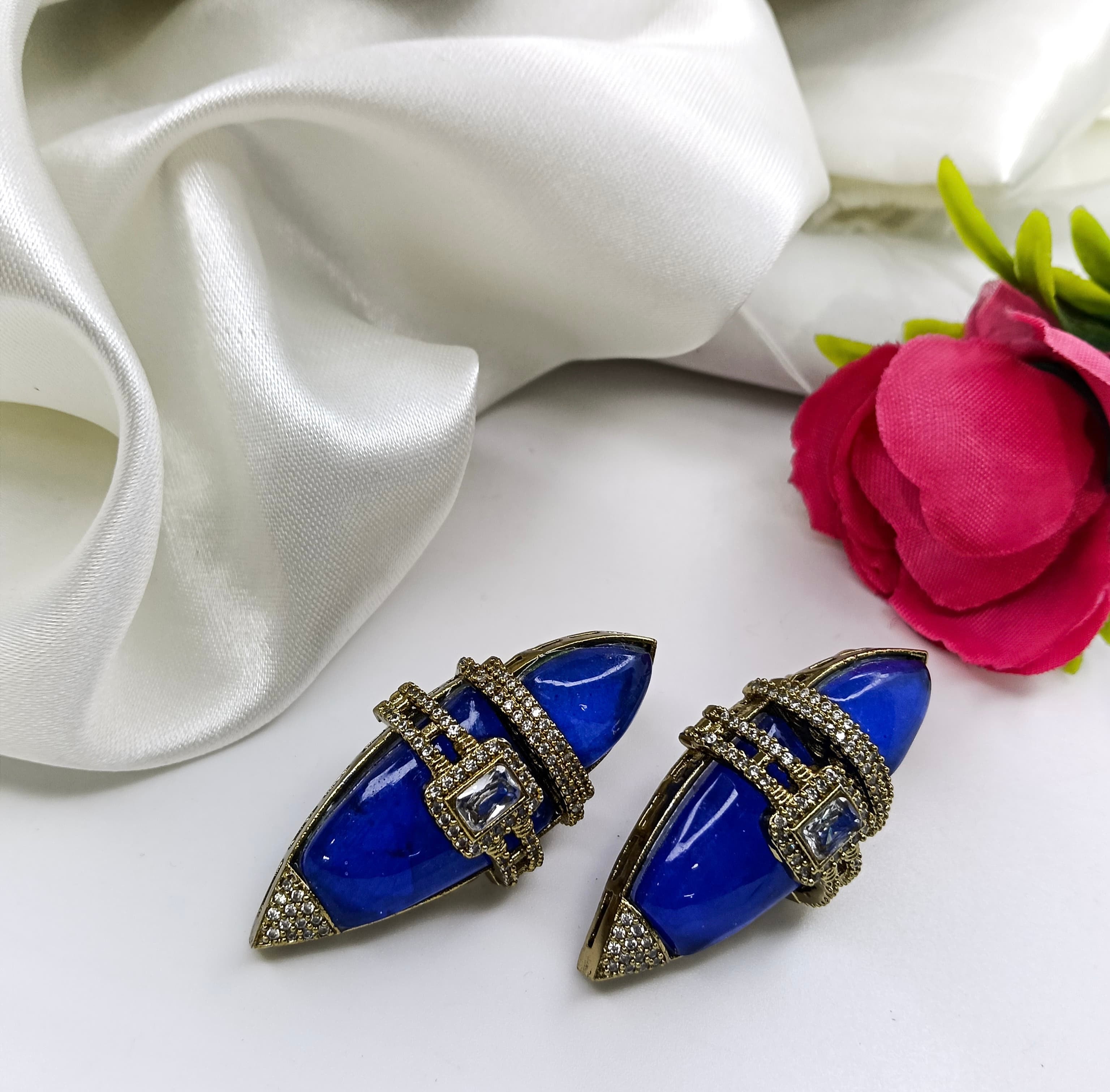 This is a pair of lapis lazuli and crystal stud earrings.