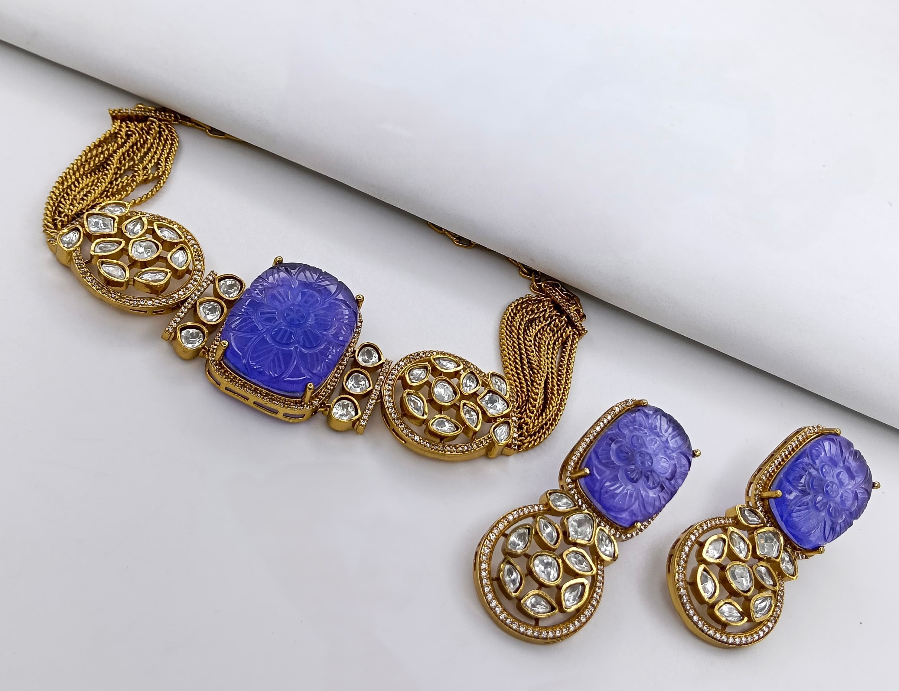 This is a Kundan and American diamond necklace and earring set.