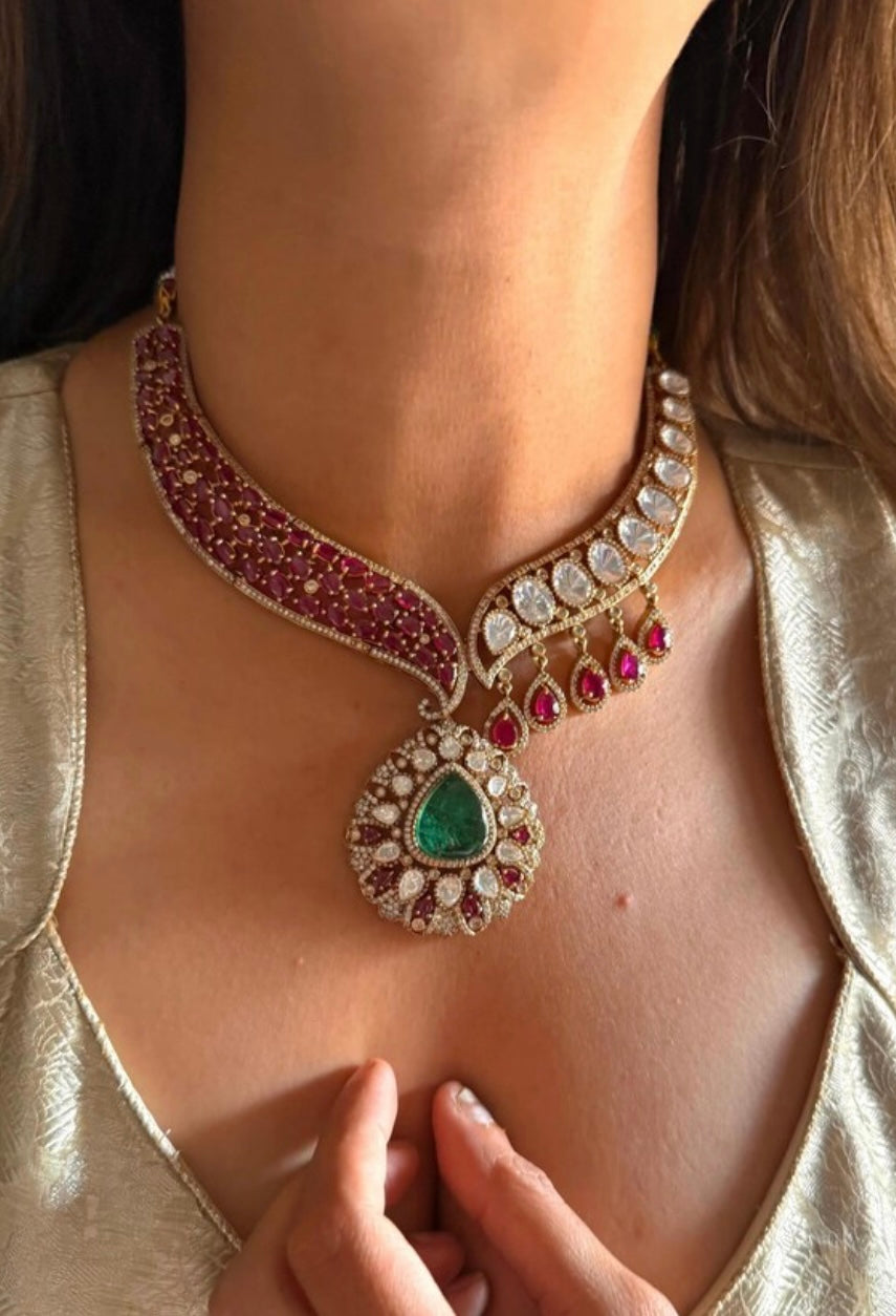 This is a Mohini Emerald doublet and rani pink moissanite polki designer collar necklace with eyerings