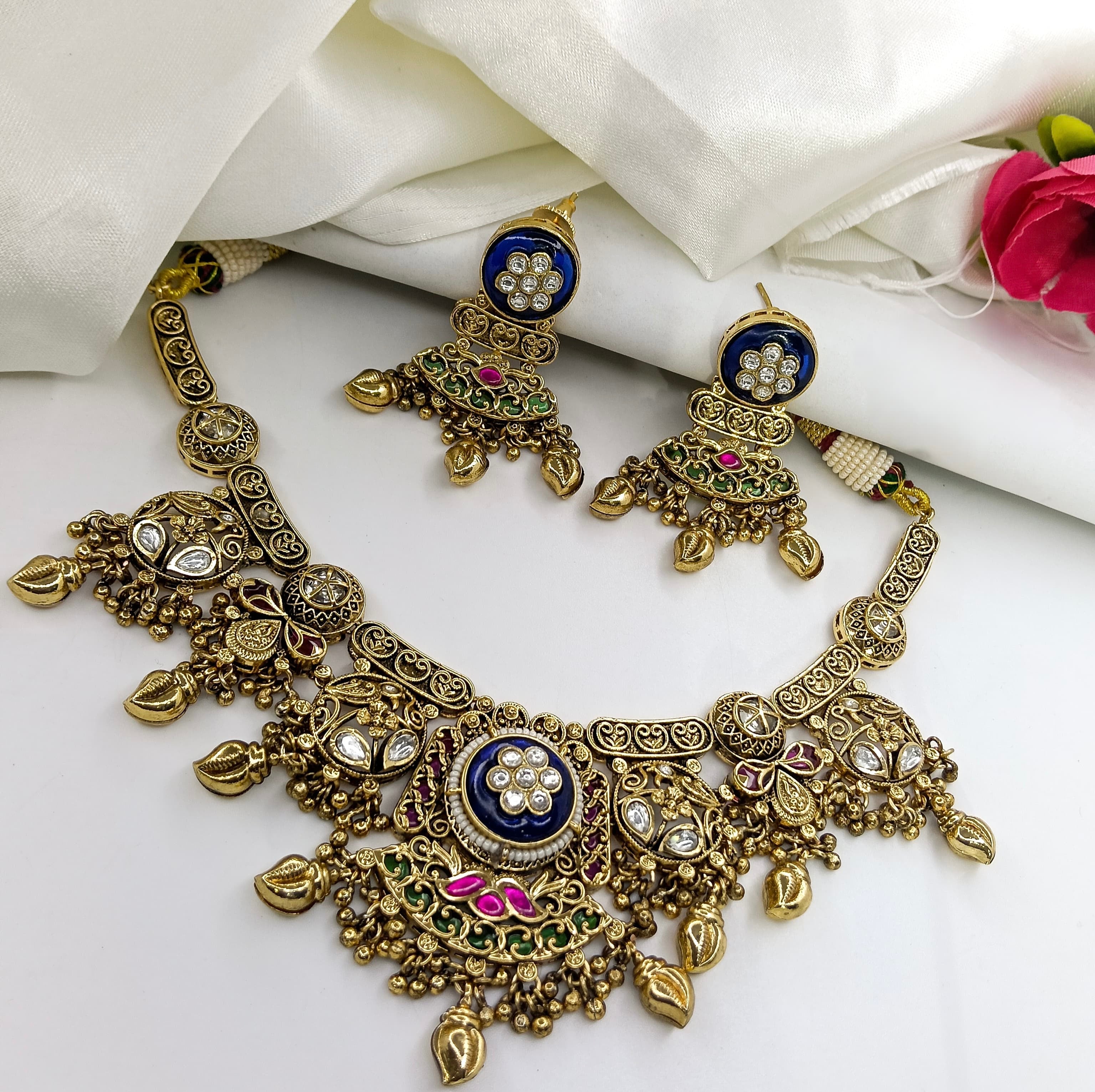 This is a matte finish choker necklace set with matching earrings.