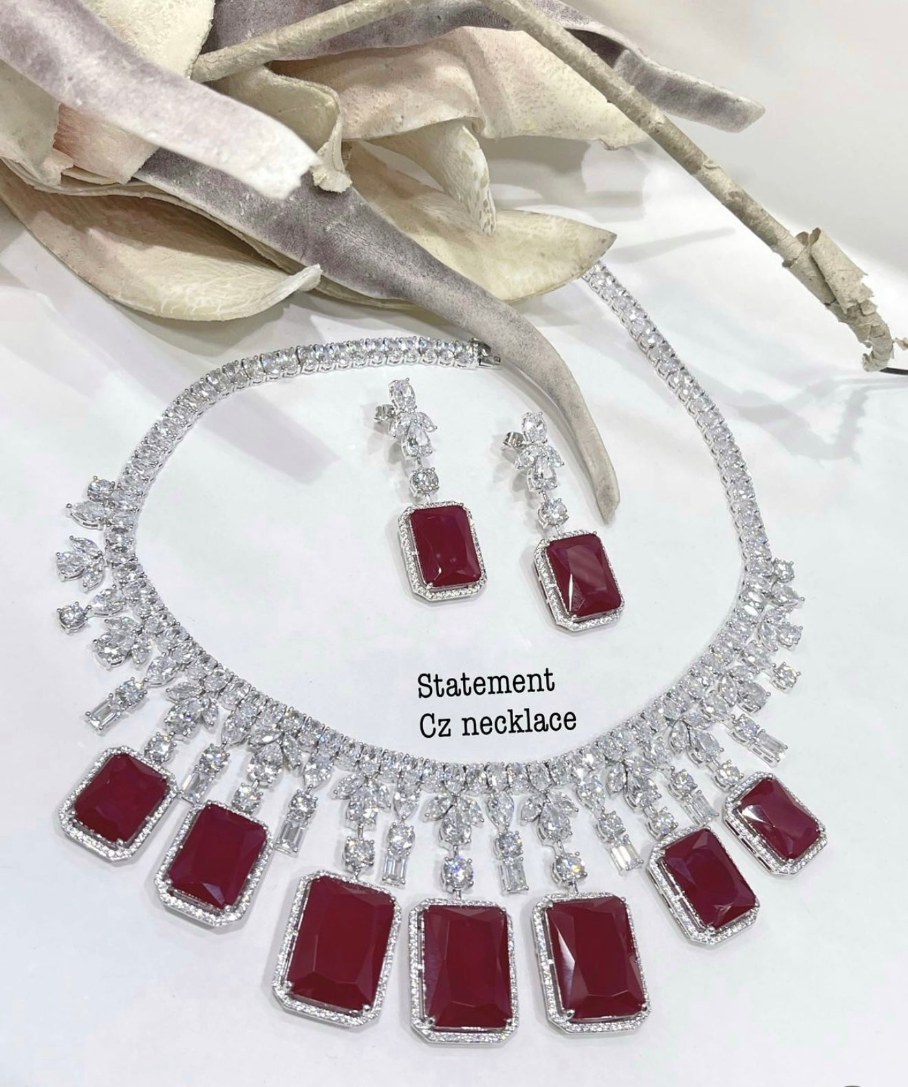 This is a Ruby cubic zirconia necklace and earring set.